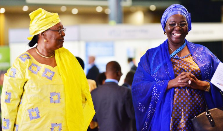 Governments of GCNF Regional Network photo shows two brightly dressed female government representatives